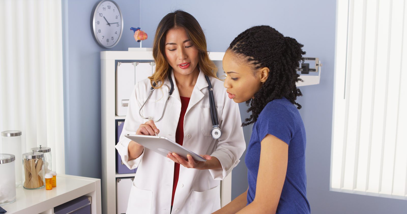 A clinician reviewing a care plan with a patient during a visit